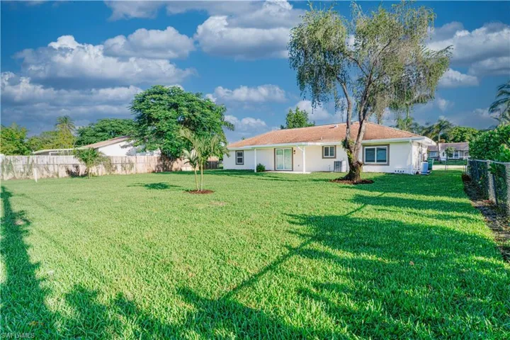 Back of house featuring a fenced backyard and a patio