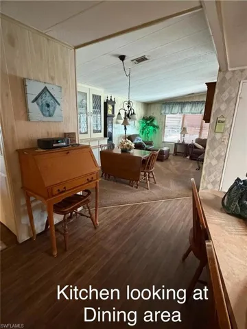 Dining space featuring dark wood finished floors