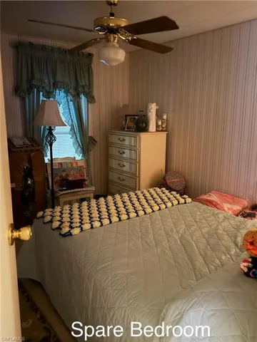 Bedroom featuring a ceiling fan