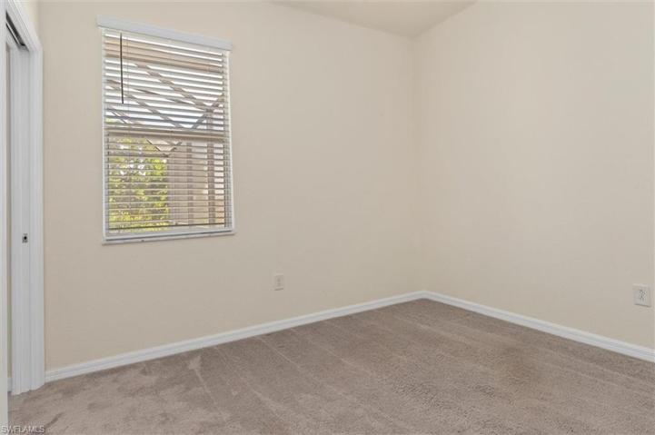 Downstairs bedroom/office with full bathroom-door to pool area