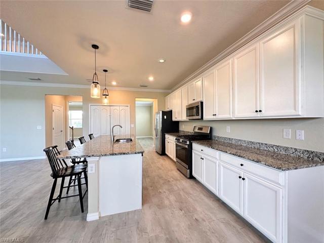 White cabinetry with granite counter tops