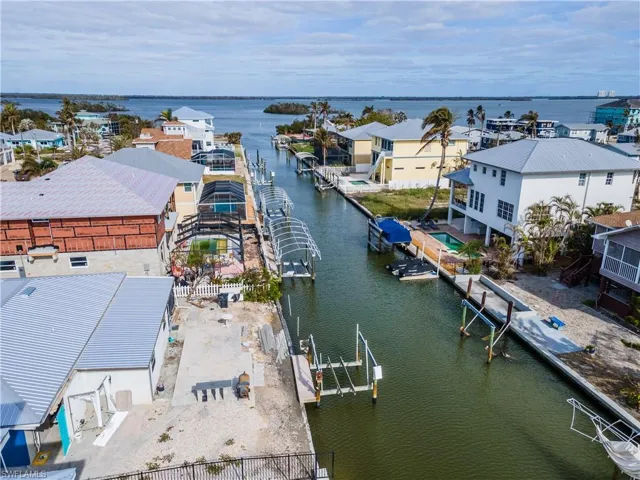 Aerial view of residential area with a large body of water