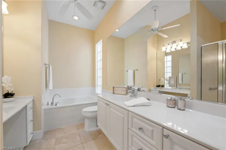 28847 Yellow Fin Tri, Bonita Springs FL 34135 - Owner's bath second side with shower entry, soaking tub, and vanity area.