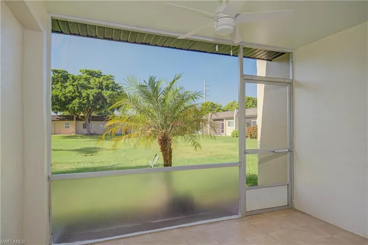 Unfurnished sunroom with a ceiling fan