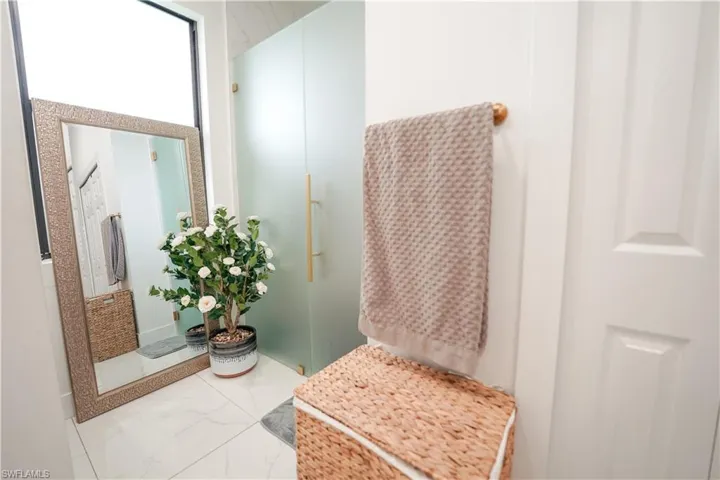 Bathroom featuring marble finish floors