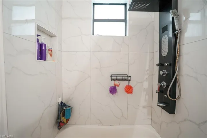 Bathroom featuring shower / bathtub combination