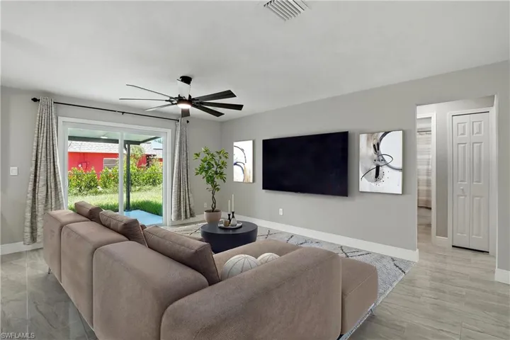 Living room featuring ceiling fan