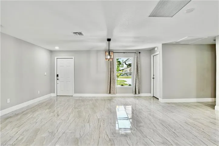 Unfurnished dining area featuring baseboards