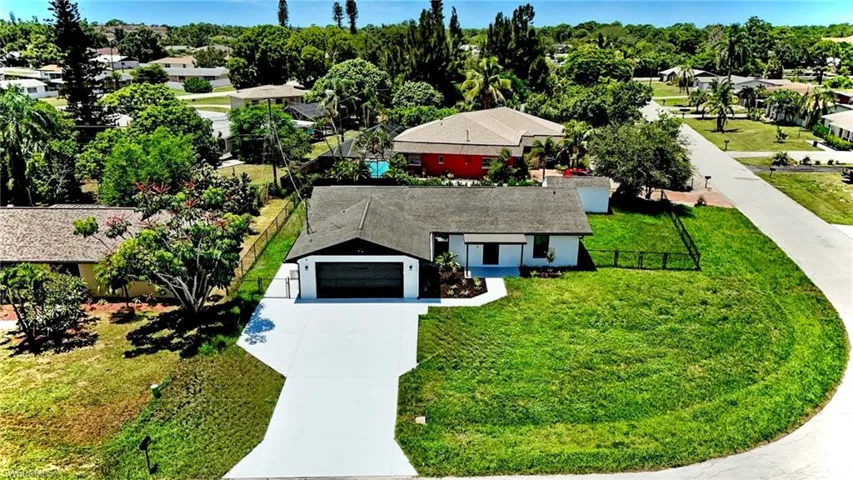 Aerial view of residential area with a tree filled landscape