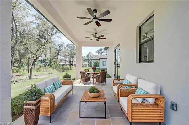 View of patio / terrace featuring an outdoor living space, ceiling fan, and outdoor dining area