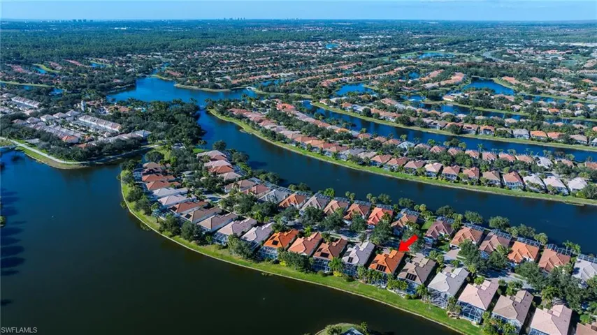 View of property location featuring a nearby body of water and nearby suburban area