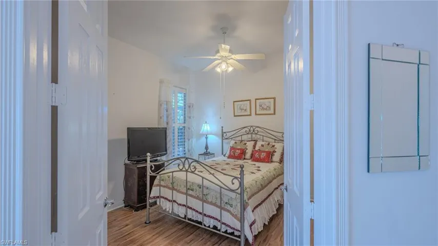 Bedroom with wood finished floors and ceiling fan