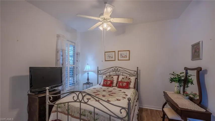 Bedroom with wood finished floors and ceiling fan