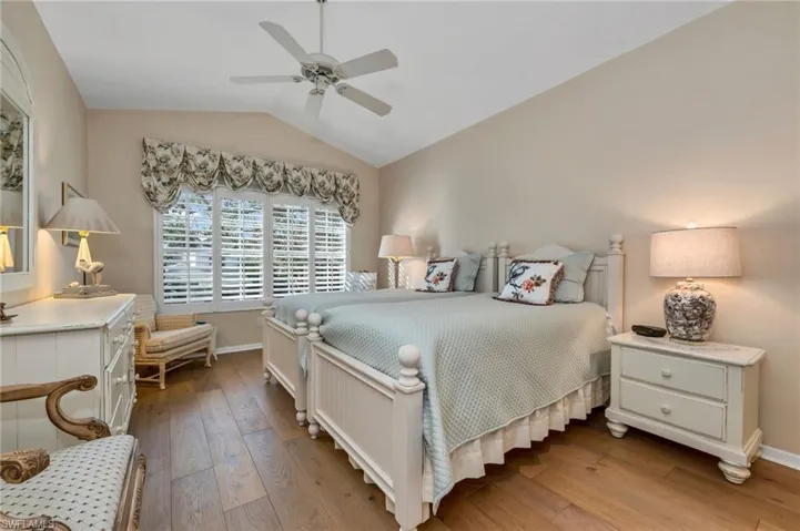 Large window in guest bedroom, oversized room.