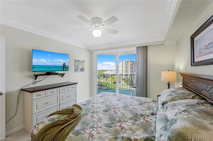 Bedroom with access to exterior, baseboards, ceiling fan, and crown molding