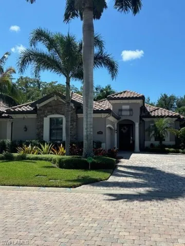 Mediterranean / spanish-style home featuring a front yard