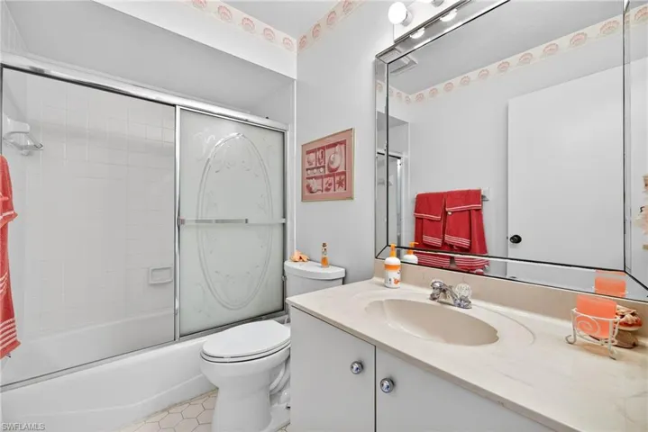 Second bath with vanity and combined bath / shower with glass door