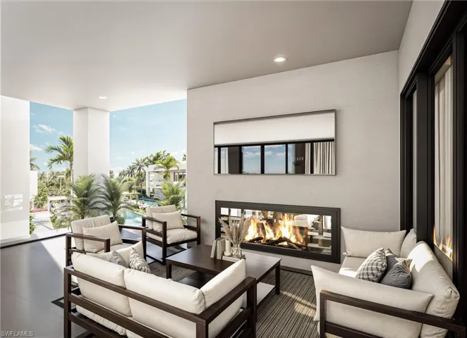 Balcony with an outdoor living space with a fireplace and view of pool