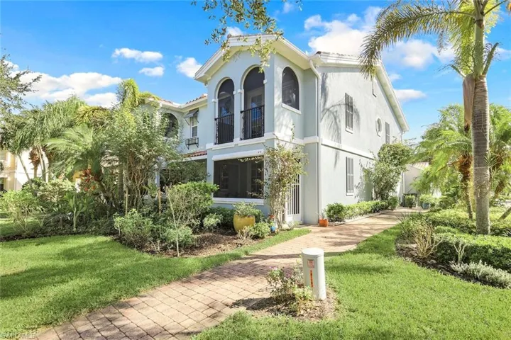 Private Side Paved Walkway featuring 2 Seperate Entrances & Lush Tropical Landscaping