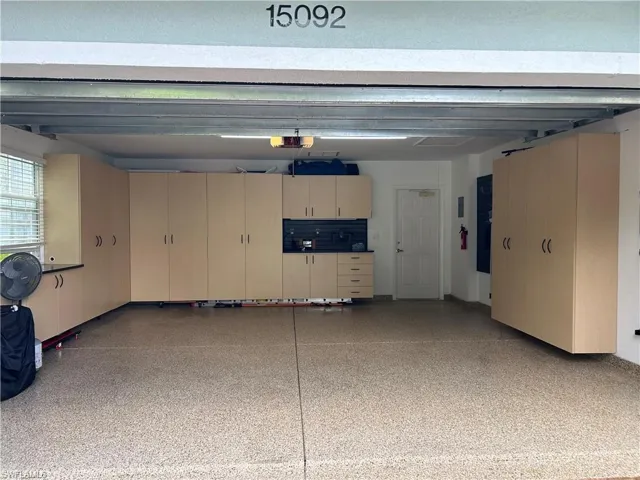 Garage with Custom Built-In's, Storage Rack & Epoxy Finished floor