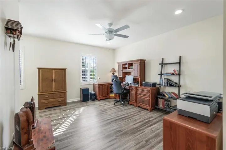 Bedroom/Office Space with Luxury Vinyl Plank flooring & Plantation Shutters
