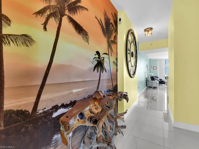 Entry foyer into unit, tropical wall with beautiful driftwood table