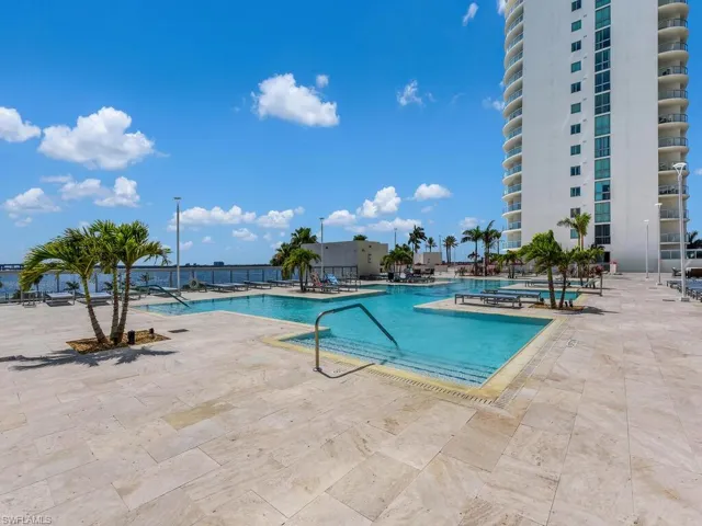 Community pool with a patio