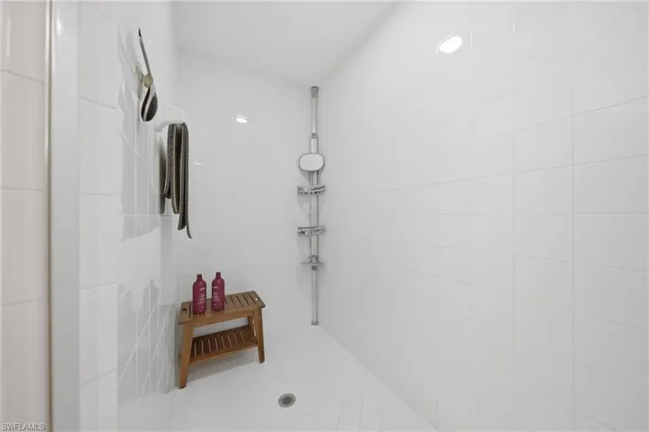 Walk-in shower in the primary bathroom with clean finishes and glass enclosure