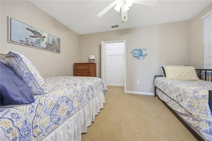 Den currently set up as a third bedroom, offering flexible living space
