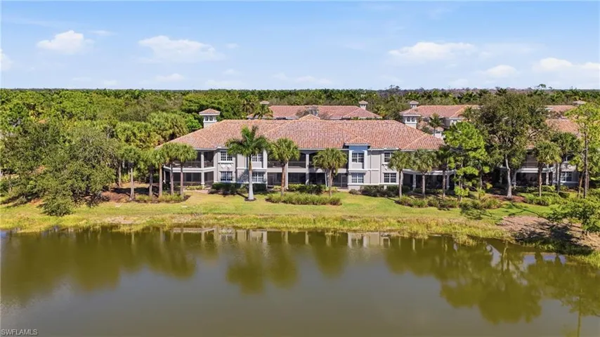 Exterior of Deer Crossing coach homes with tropical landscaping