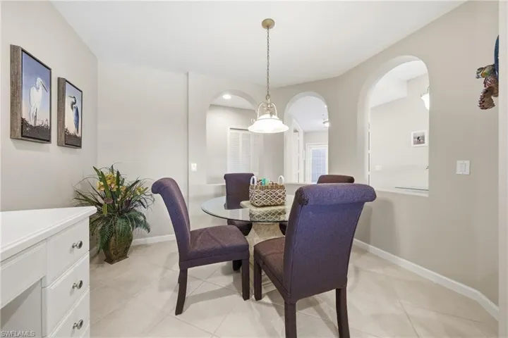 Eat-in kitchen area with open walls, natural light, and seamless flow to the living space