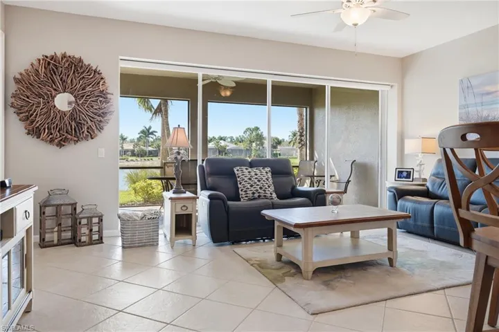 Living area flowing seamlessly to lanai with tranquil water views