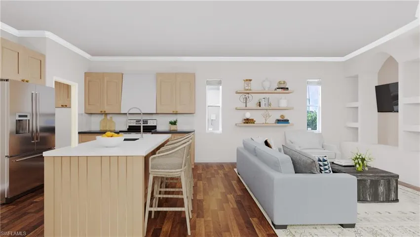 Kitchen featuring dark hardwood / wood-style flooring, high end fridge, a center island with sink, and light brown cabinets