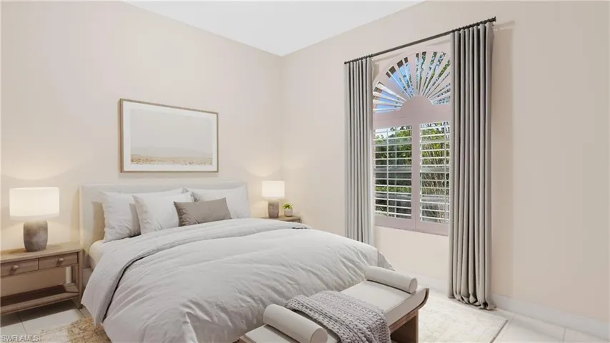 Bedroom with light tile patterned flooring