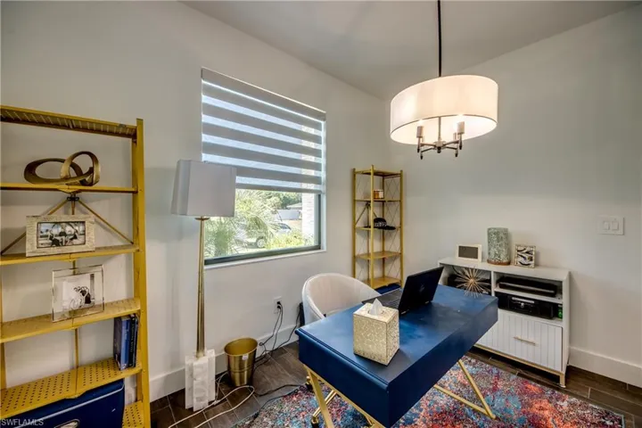 Office space featuring wood finish floors and baseboards