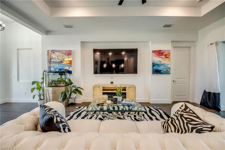 Living area featuring dark wood-style floors
