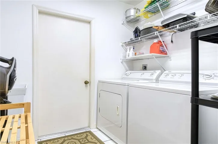 Laundry room with washing machine and clothes dryer