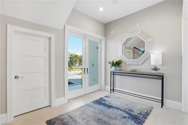 Double door impact glass, tile foyer, ample storage closet.