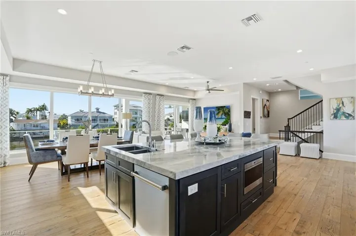 Oversized island, Quartzite countertop, undermount Wolf microwave oven, dishwasher, garbage disposal.