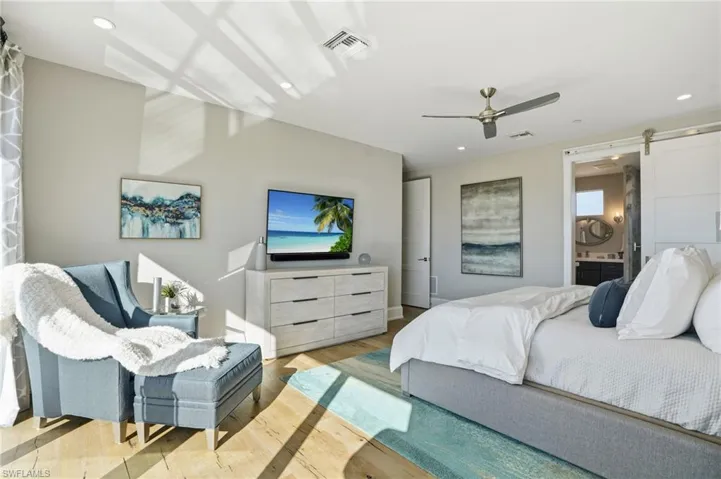 Ensuite oversized walk-in closet, balcony with water view.