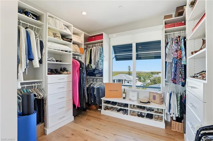 Walk-in closet, custom cabinetry, built ins, oak hardwood floors, motorized window treatments.