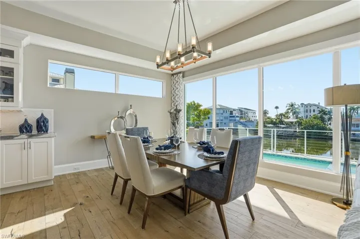 Stunning oak hardwood flooring overlooking pool and spa, waterfront.