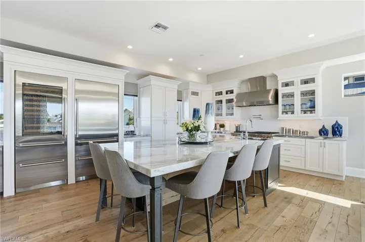 Oversized island, Quartzite countertops, Sub-Zero, Wolf appliances, pot filler.