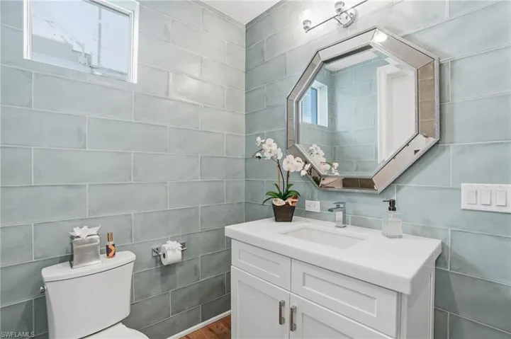 Pool bathroom, custom cabinetry, designer tile.