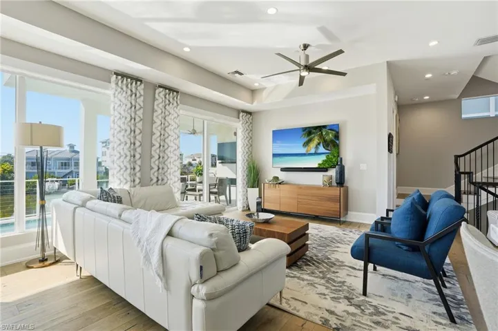 Motorized window treatments, impact sliders, Sonos sound system throughout home.