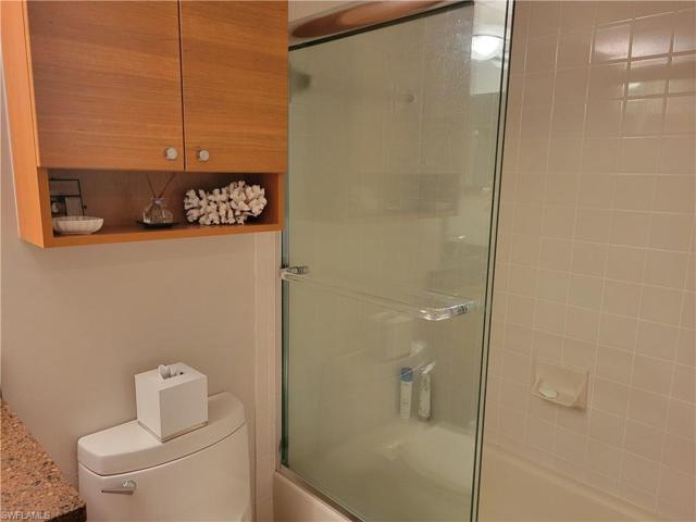 Guest bath with newer toilet and shower door