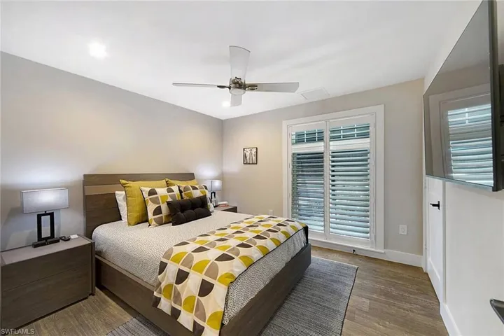 Spacious Guest bedroom with plantation shutters. Closet is also from California Closets.