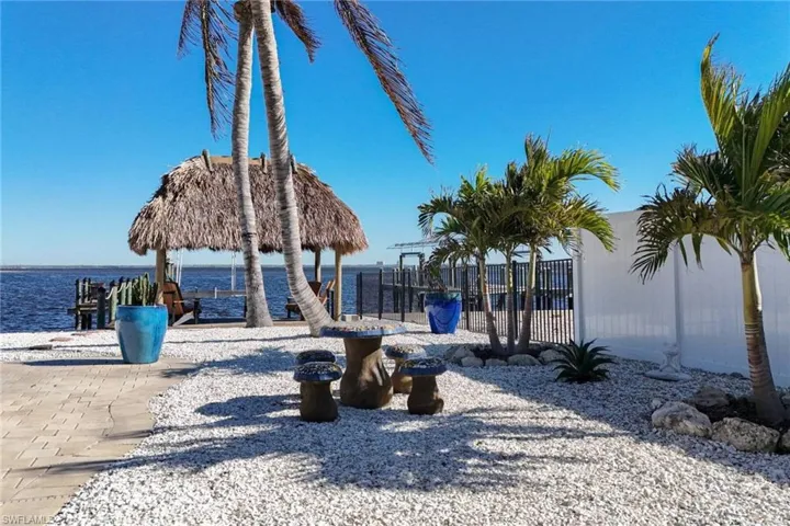 Shell yard and partial privacy fence on east side