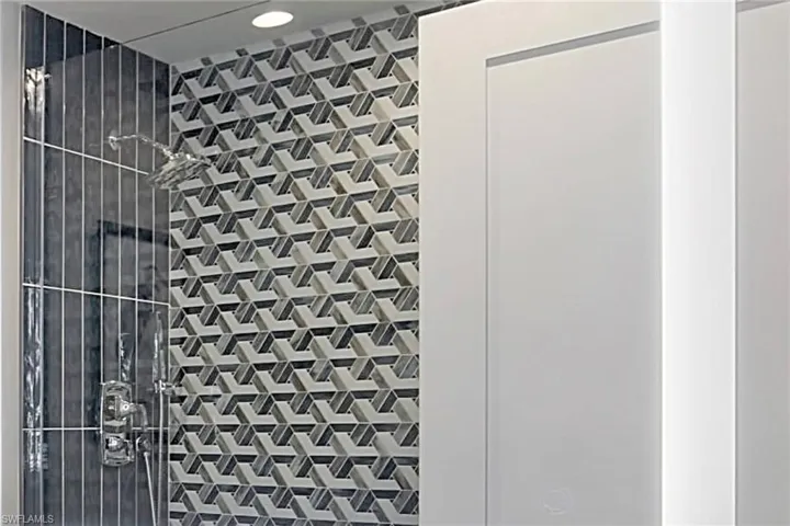 Guest Bath with Silestone counter, LED mirror, & WOW shower tile!
