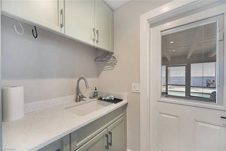 Laundry sink & door to lanai.